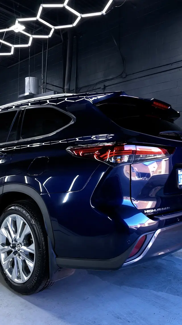 Blue Toyota Highlander rear quarter and paint reflections after detailing